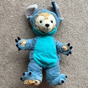 Walt Disney world Duffy the bear in a Stitch costume.